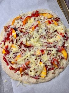 PEACHY STEAK AND BACON PIZZA WITH HERBY CHEESE AND BANANA PEPPER SAUCE